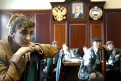 Relative of seven murdered businessmen wait in the office of Mustafa Batduyev, the leader of the Karachayevo-Cherkessia region, demanding his resignation, in the region's capital Cherkessk, November 10, 2004. The small, mainly Muslim Karachayevo-Cherkessia region has been hit by protests since the disappearance last month of seven businessmen, in which Batduyev's son-in-law is a prime suspect. The discovery of their bodies in a mineshaft sparked fresh riots on Tuesday when protesters stormed into government headquarters in the regional capital Cherkessk and demanded Batdyyev quit.       REUTERS/Eduard Kornienko