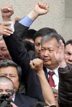 Kyrgyz opposition leader Kurmanbek Bakiyev in front of the Parliament building in Bishkek March 25. Kyrgyzstan's newly formed interim government is taking measures to restore order in the Central Asian country after two days of unrest that left the government collapsed and three people dead.